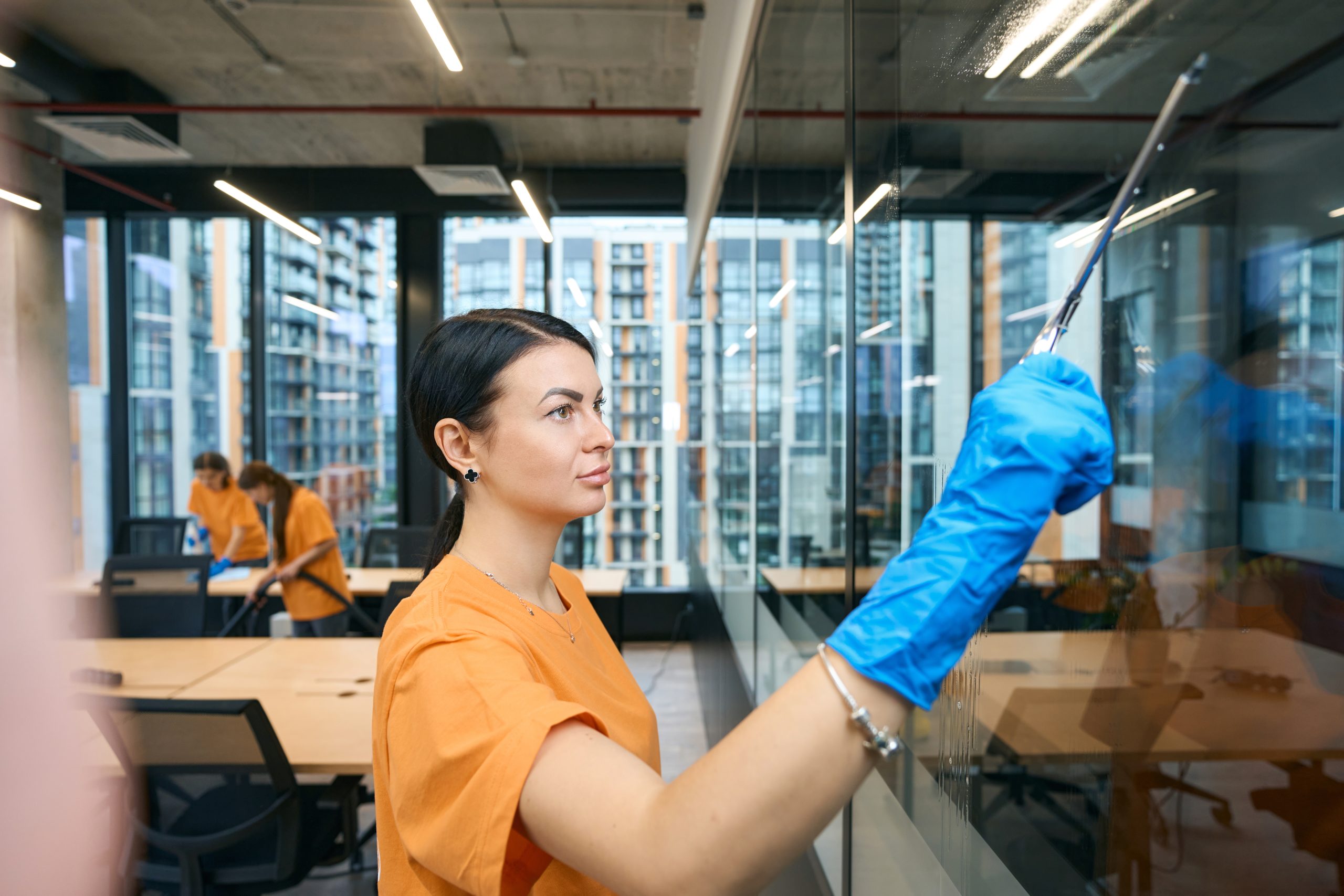 Qualified employees of the cleaning company clean and disinfect all surfaces in the coworking space